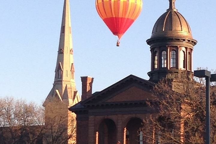 a close up of a church with a hot hair a balloon
