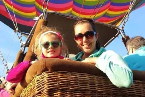 A woman and a child in a hot air balloon